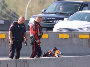 Calgary police investigate after a fatal motorcycle collision on the Calf Robe Bridge closing Southbound Deerfoot Trail on Saturday, September 10, 2022.