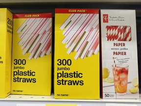 Plastic straws for sale next to paper straws at a Real Canadian Superstore in Calgary on Wednesday, Oct. 7, 2020. Canada is banning plastic bags, straws, cutlery and other single-use plastic items by the end of 2021.