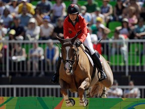 Switzerland’s Janika Sprunger’s pregnancy allowed her partner, Henrik von Eckermann, to compete with her horse, King Edward.