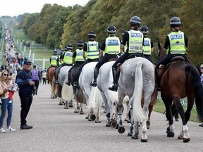 Police officers on horseback practice a routine, following the death of Britain's Queen Elizabeth, near Windsor Castle, September 16, 2022.
