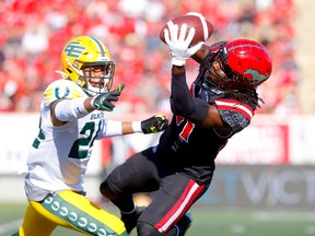 Calgary Stampeders receiver Luther Hakunavanhu makes a big catch while being covered by Edmonton Elks defensive back Jeremie Dominique at McMahon Stadium in Calgary on Monday, Sept. 5, 2022.