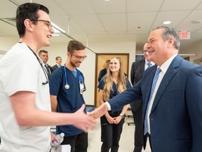 Premier Jason Kenney greets some of the MRU students present at an Alberta government announcement at the Nursing Simulation Lab at Mount Royal University on Thursday, October 6, 2022.