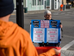 Anne Landry, a resident of Boardwalk Skygate Tower and a group of Calgarians participate in a rally organized by ACORN Tenant Union for rent control outside the Boardwalk head office on Saturday, October 29, 2022.
