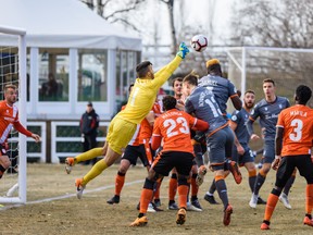 Cavalry FC goalkeeper Marco Carducci makes a save against Forge FC during the second and final leg of the 2019 CPL Finals on ATCO Field at Spruce Meadows 
on Nov. 2. Cavalry lost by a combined score of 2-0 (1-0 in each leg) as Forge captured the inaugural CPL title.