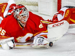 Calgary Flames goalie Jacob Markstrom makes a save against the Carolina Hurricanes during NHL hockey action at the Scotiabank Saddledome in Calgary on Saturday, October 22, 2022.