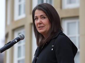 Premier Danielle Smith speaks with media after her cabinet was sworn in at Government House in Edmonton on Oct. 24, 2022.