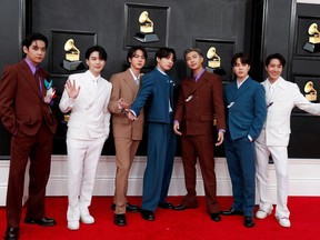BTS pose on the red carpet as they attend the 64th Annual Grammy Awards at the MGM Grand Garden Arena in Las Vegas April 3, 2022.