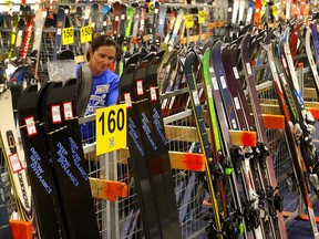 Kristin Lang helps set up for the Calgary New and Used Ski Sale which kicks off Friday at 5 p.m. at Max Bell Centre.