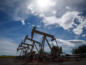 Pumpjacks draw oil out of the ground near Olds, Alta., on July 16, 2020.