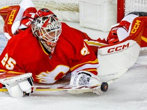 Calgary Flames goaltender Jacob Markstrom makes a save against the Carolina Hurricanes at Scotiabank Saddledome in Calgary on Saturday, Oct. 22, 2022.