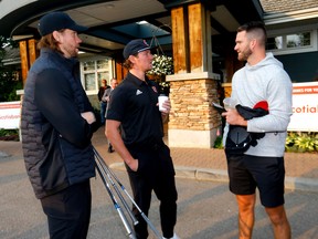 From left, goaltender Jacob Markstrom and forwards Tyler Toffoli and Jonathan Huberdeau during the Calgary Flames Celebrity Charity Golf Classic at the Country Hills Golf Club in Calgary on Sept. 14, 2022.