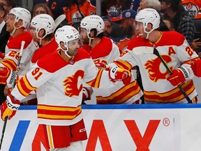 Oct 15, 2022; Edmonton, Alberta, CAN; The Calgary Flames celebrate a goal scored by forward Name Kadri (91) during the first period against the Edmonton Oilers at Rogers Place.