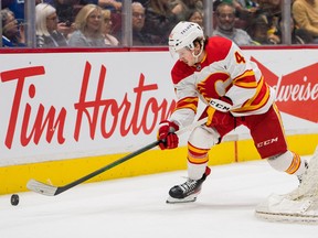 Sep 25, 2022; Vancouver, British Columbia, CAN; Calgary Flames forward Matthew Phillips (41) handles the puck  against the Calgary Flames in the second period at Rogers Arena. Mandatory Credit: Bob Frid-USA TODAY Sports