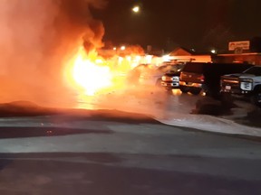 Fire destroys several vehicles including police cars in and early morning fire in the parking lot of the Smithers hotel, Oct. 26, 2022.