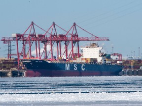A container ship is docked in the Port of Montreal, Wednesday, February 17, 2021.