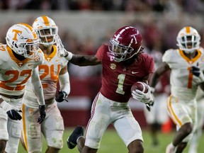 Alabama Crimson Tide wide receiver Jameson Williams runs after a catch as Tennessee Volunteers defensive back Jaylen McCollough (22) pursues at Bryant-Denny Stadium in Tuscaloosa, Ala., on Oct. 23, 2021. Alabama won 52-24 for its 16th straight victory in the rivalry.