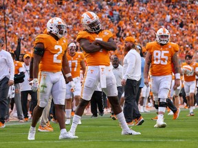 Oct 15, 2022; Knoxville, Tennessee, USA; Tennessee Volunteers quarterback Joe Milton III (7) reacts to a score against the Alabama Crimson Tide during the second half at Neyland Stadium. Mandatory Credit: Randy Sartin-USA TODAY Sports