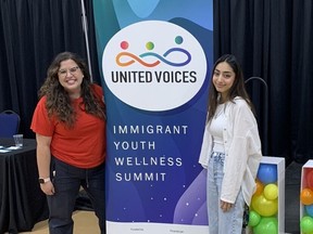 Hanne Brahim, left, and Fiza Rajput at United Voices: Immigrant Youth Wellness Summit in Calgary on Oct. 22, 2022.