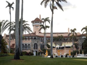 President Donald Trump's Mar-a-Lago estate is seen from the media van in the presidential motorcade in Palm Beach, Fla., March 24, 2018.