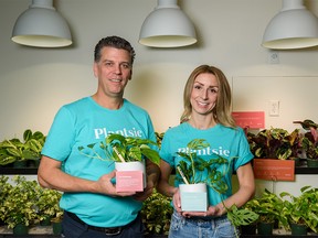 Plantsie co-founders Jeff Bradshaw and Jaime Starchuk pose for a photo at their newly opened store at Southcentre Mall on Tuesday, November 1, 2022.