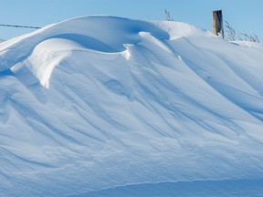 Wind-sculpted snowdrift near Carseland, Ab., on Wednesday, November 9, 2022.