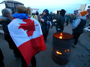 Protesters at a road block on Highway 4 outside of Milk River heading towards the Coutts border crossing on Tuesday, February 8, 2022.