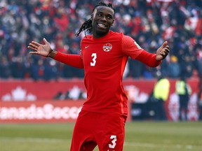 Sam Adekugbe #3 of Canada reacts to the crowd during a 2022 World Cup Qualifying match against Jamaica at BMO Field on March 27, 2022 in Toronto, Ontario, Canada.