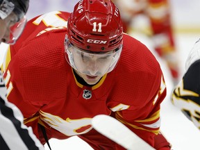 Mikael Backlund #11 of the Calgary Flames faces off during a game against the Tampa Bay Lightning at Amalie Arena on November 17, 2022 in Tampa, Florida.