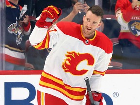Jonathan Huberdeau #10 of the Calgary Flames waves to fans during a warmup as he returns to South Florida to face his former team, the Florida Panthers, at FLA Live Arena in Sunrise, Florida, November 19, 2022 .