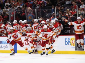 The Calgary Flames celebrate a 5-4 shootout victory over the Florida Panthers at FLA Live Arena in Sunrise, Fla., on Saturday, Nov. 19, 2022.
