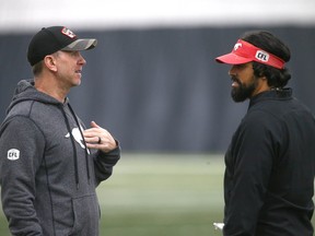 Calgary Stampeders coach Dave Dickenson (L) and Mark Kilam at  practice in Calgary on Wednesday, November 2, 2022. The team practiced indoors for the first time at the new inflatable dome at Shouldice. Jim Wells/Postmedia