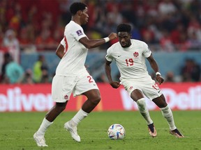 Canada's forward #19 Alphonso Davies controls the ball during the Qatar 2022 World Cup Group F football match between Belgium and Canada at the Ahmad Bin Ali Stadium in Al-Rayyan, west of Doha on November 23, 2022.