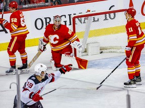 Calgary Flames goaltender Jacob Markstrom reacts after giving the New Jersey Devils Fabian Zetterlund the overtime goal during an NHL hockey game at the Scotiabank Saddledome in Calgary on Saturday November 5, 2022.