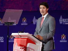 Prime Minister Justin Trudeau delivers his address during the B20 Summit, ahead of the G20 leaders' summit, in Nusa Dua, Bali, Indonesia, Monday, Nov. 14, 2022.
