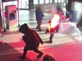 A suspect catches fire after a flare gun is fired during a brawl at the Marlborough CTrain station on Nov. 17, 2022.