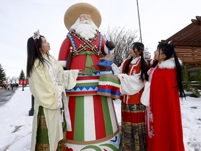 Left to right, Lydia Li, Shuxin Wang and Lu Wang from the Calgary Hanfu Society check out one of the many displays at the Spruce Meadows International Christmas Market. The market was ranked in the top 5 in the world. Photo taken in Calgary on Sunday, November 20, 2022.