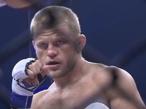 Screenshot of MMA fighter Alexander Pisarev during match.