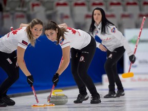 Canada skip Kerri Einarson follows her front end of lead Briane Harris and second Shannon Birchard during their game against the United States during the Pan Continental Curling Championships at the WinSport Event Centre in Calgary on Thursday, Nov. 3, 2022.