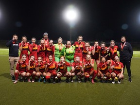 The University of Calgary Dinos women’s soccer team celebrates after capturing the bronze medal during the Canada West championship at Thunderbird Stadium in Vancouver on Saturday, Nov. 5, 2022.