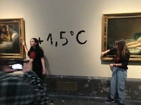 Climate protesters from Extinction Rebellion stick themselves to Goya's paintings "Las maja naked" and "La maja ropa" to alert about the climate emergency in Madrid, Spain November 5, 2022 in this picture obtained from social media.