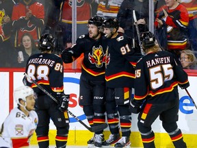 The Calgary Flames celebrate a goal by defenceman Rasmus Andersson against the Florida Panthers at Scotiabank Saddledome in Calgary on Tuesday, Nov. 29, 2022.