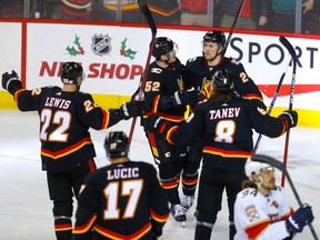 The Calgary Flames celebrate a goal by Brett Ritchie against the Florida Panthers at Scotiabank Saddledome in Calgary on Tuesday, Nov. 29, 2022.