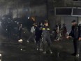 Hamas police officers secure the scene of burned apartment on the third floor of a three-storey building in Jebaliya refugee camp, northern Gaza Strip, Thursday, Nov. 17, 2022.