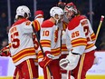 Calgary Flames forward Jonathan Huberdeau celebrates with goaltender Jacob Markstrom after their win over the Philadelphia Flyers at Wells Fargo Center in Philadelphia on Monday, Nov. 21, 2022.