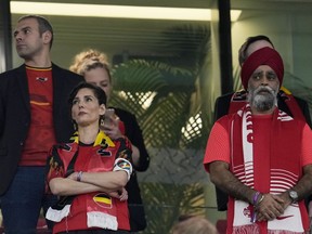 Minister of International Development Harjit Sajjan, right, looks on as Belgium Foreign Minister Hadja Lahbib, wears a "One Love" armband on the tribune during the World Cup group F soccer match between Belgium and Canada, at the Ahmad Bin Ali Stadium in Doha, Qatar, Wednesday, Nov. 23, 2022.