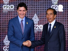 Prime Minister Justin Trudeau is greeted by the President of the Indonesian Republic Joko Widodo during the formal welcome ceremony to mark the beginning of the G20 Summit on Nov. 15, 2022 in Nusa Dua, Indonesia.