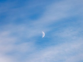 Half moon in the late afternoon sky near Chancellor, Ab., on Tuesday, November 29, 2022.