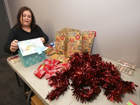 Lesley Plumley from LP Events prepares gift bags and table settings for upcoming seasonal parties near Calgary on Monday, December 5, 2022.