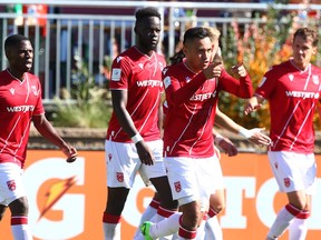Jose Escalante, second from right, celebrating a Cavalry FC goal, last season, is on several players returning to the club on contract extensions.