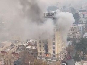 View of a hotel fire in Shahr-e-Naw neighbourhood where gunfire was also heard in Kabul, Afghanistan December 12, 2022 in this still image from social media video obtained by Reuters.